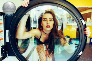 Highly commended award for laundry day portrait of model behind the washing machine window
